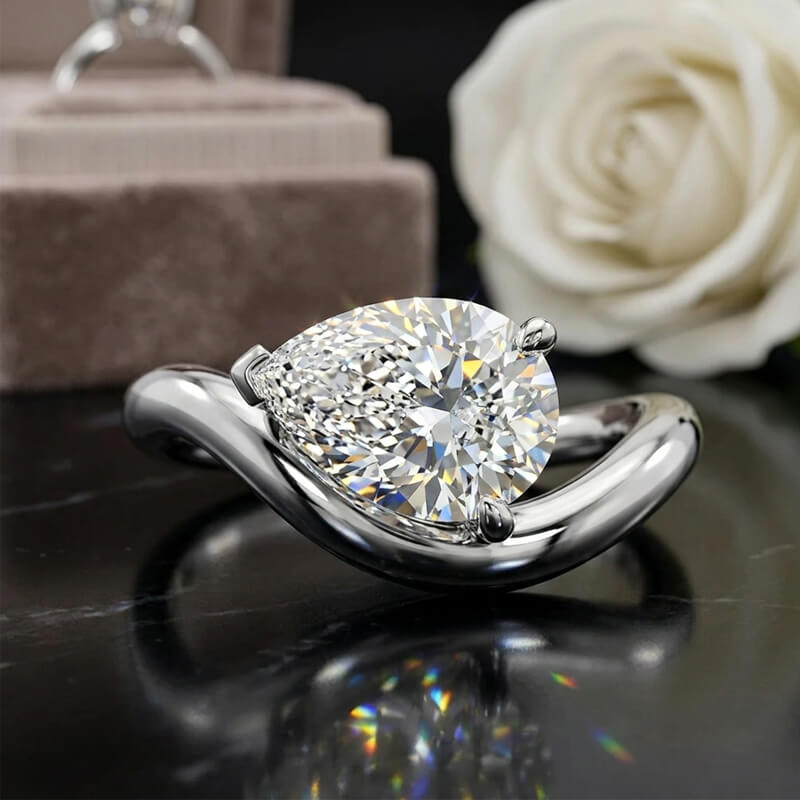 Silhouette Solitaire Pear Cut Moissanite Engagement Ring