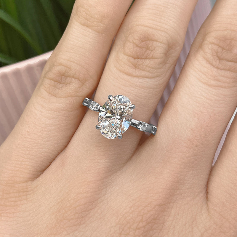 Hidden Halo Oval Moissanite Side Stone Engagement Ring