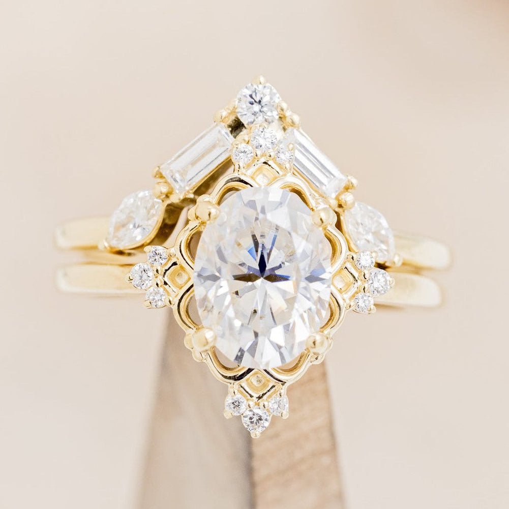 "Treva" - Oval Moissanite Engagement Ring With Diamond Accents & "Melody" Tracer