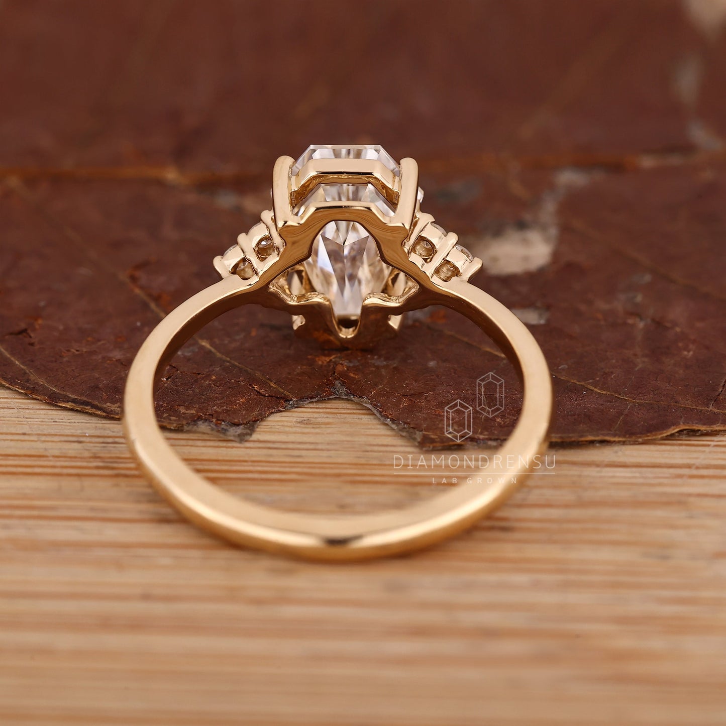 Coffin Cut Diamond Ring with Round Side Stones and Muse Setting