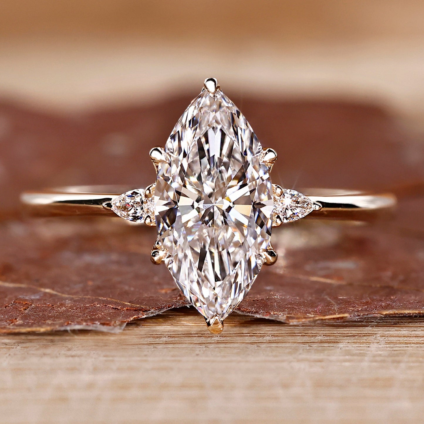 Marquise and Pear Cut Three Stone Engagement Ring