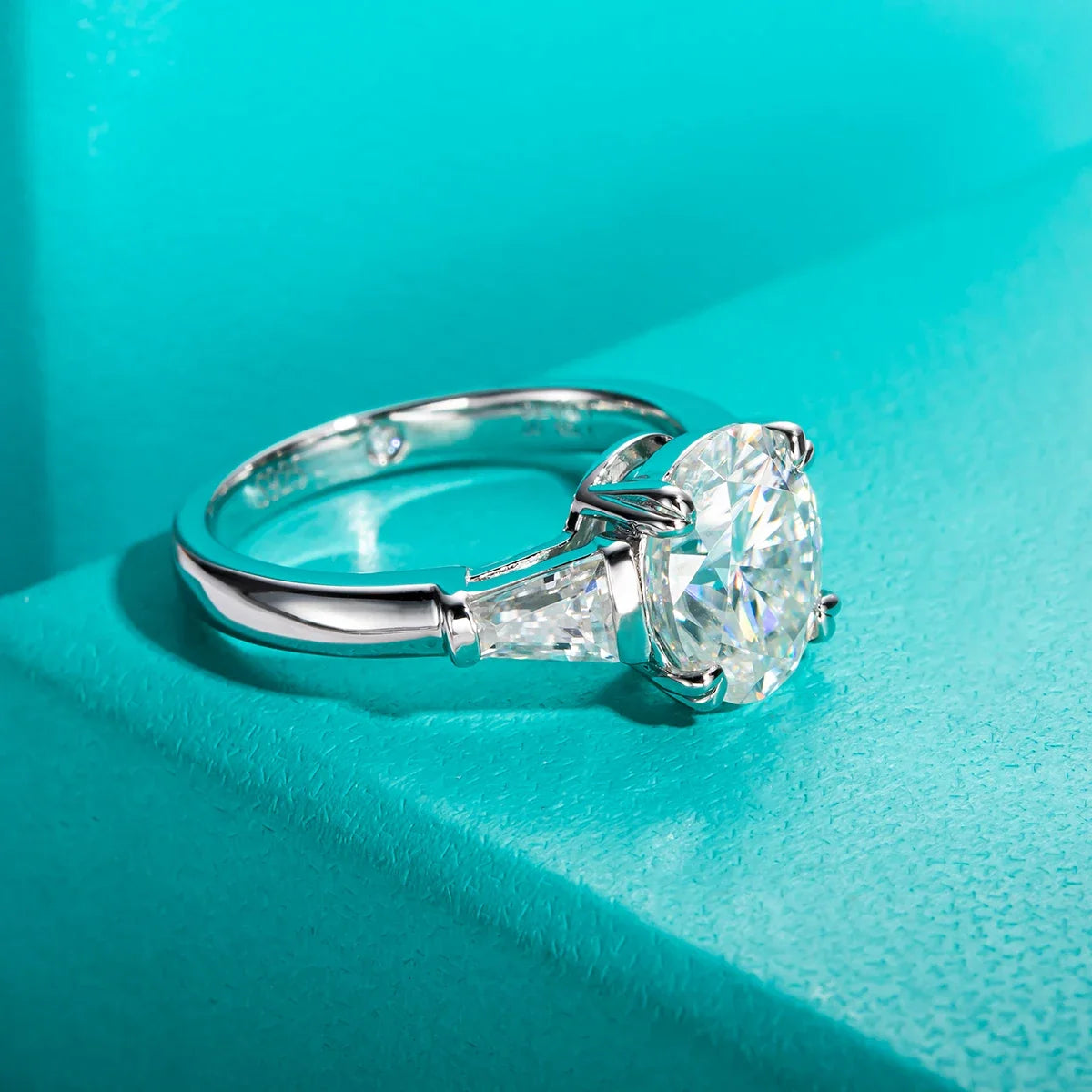 Three Stone Oval Moissanite And Tapered Baguette Engagement Ring