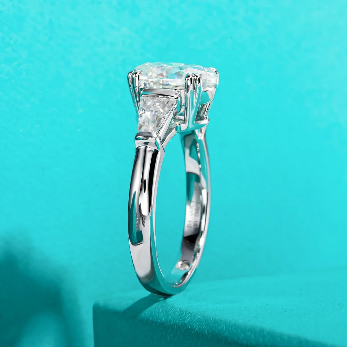 Three Stone Oval Moissanite And Tapered Baguette Engagement Ring