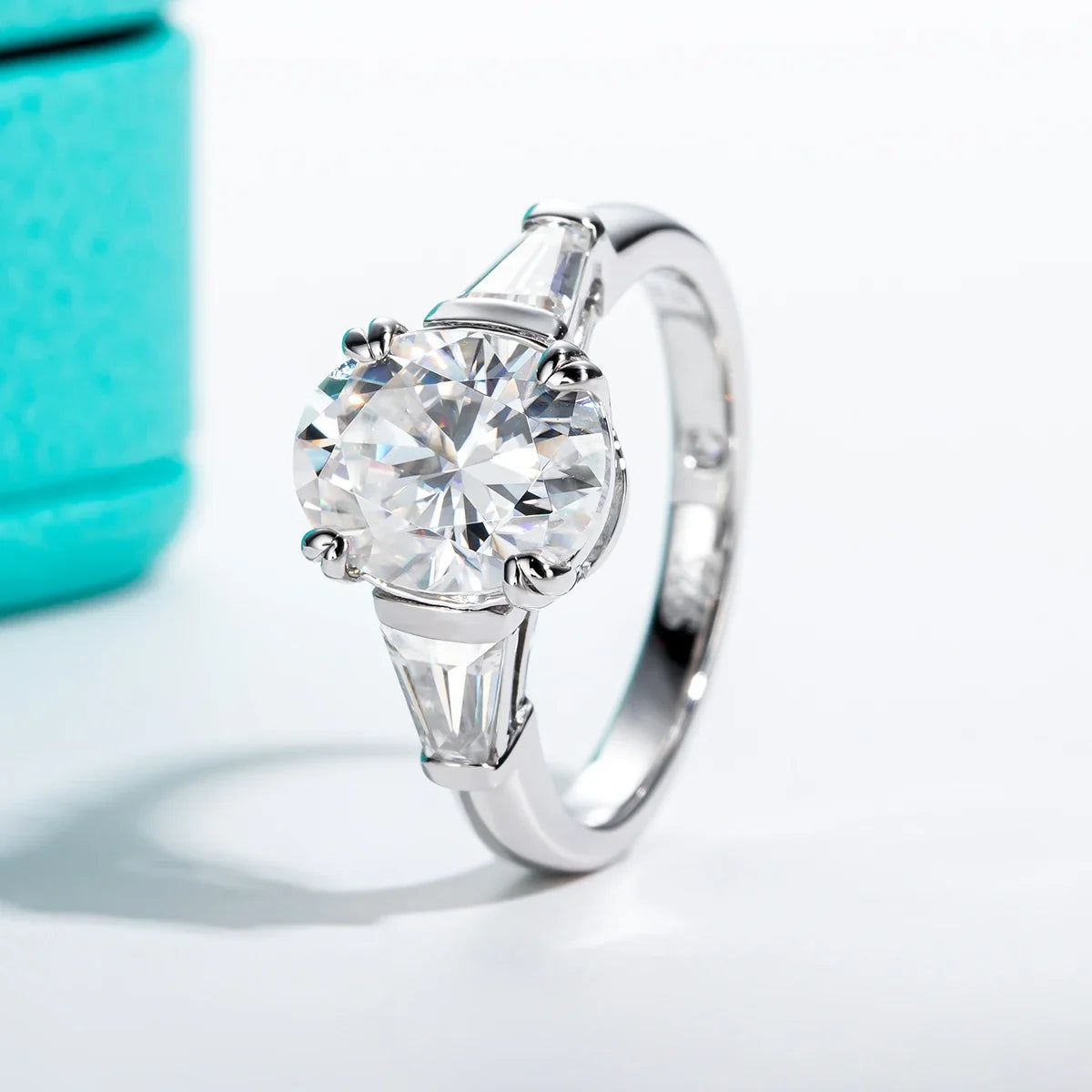 Three Stone Oval Moissanite And Tapered Baguette Engagement Ring