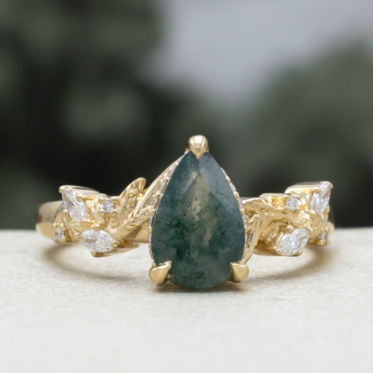 "Catori" - Pear Cut Moss Agate Engagement Ring On A Leaf Style Band With A Hidden Halo
