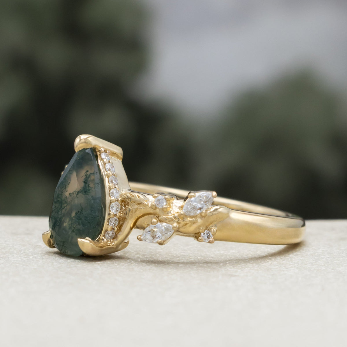 "Catori" - Pear Cut Moss Agate Engagement Ring On A Leaf Style Band With A Hidden Halo