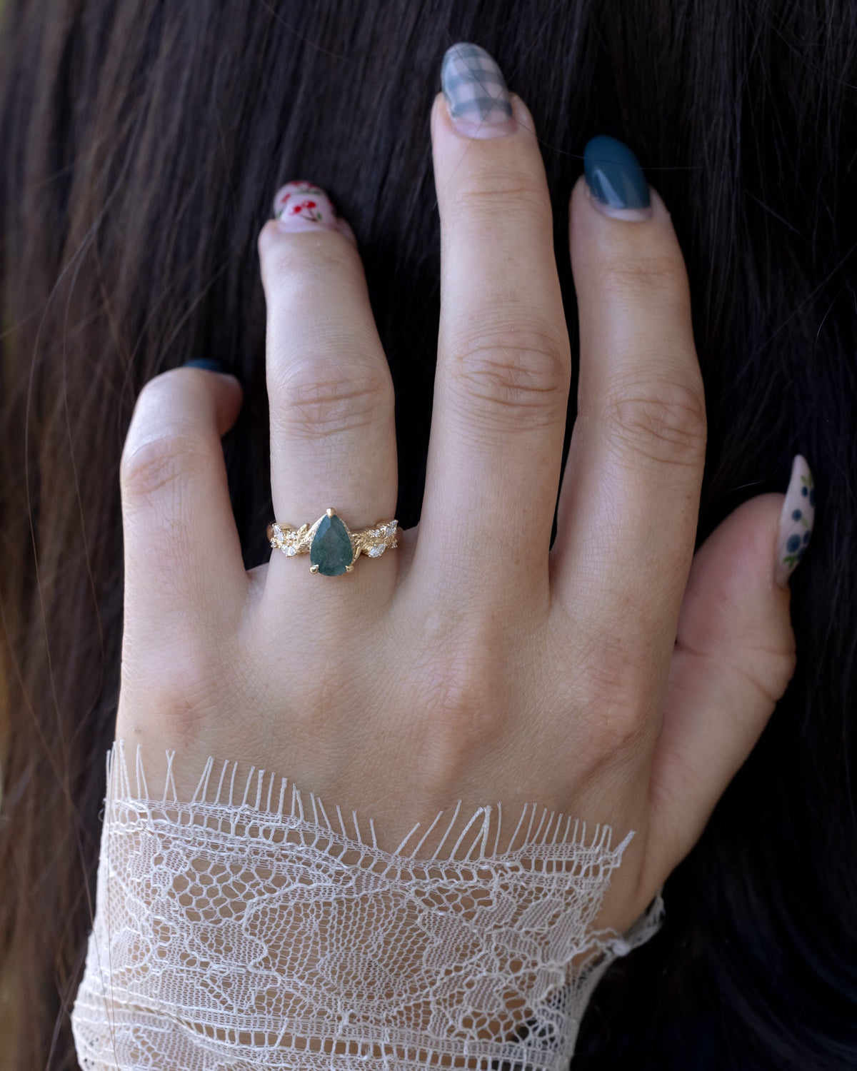 "Catori" - Pear Cut Moss Agate Engagement Ring On A Leaf Style Band With A Hidden Halo