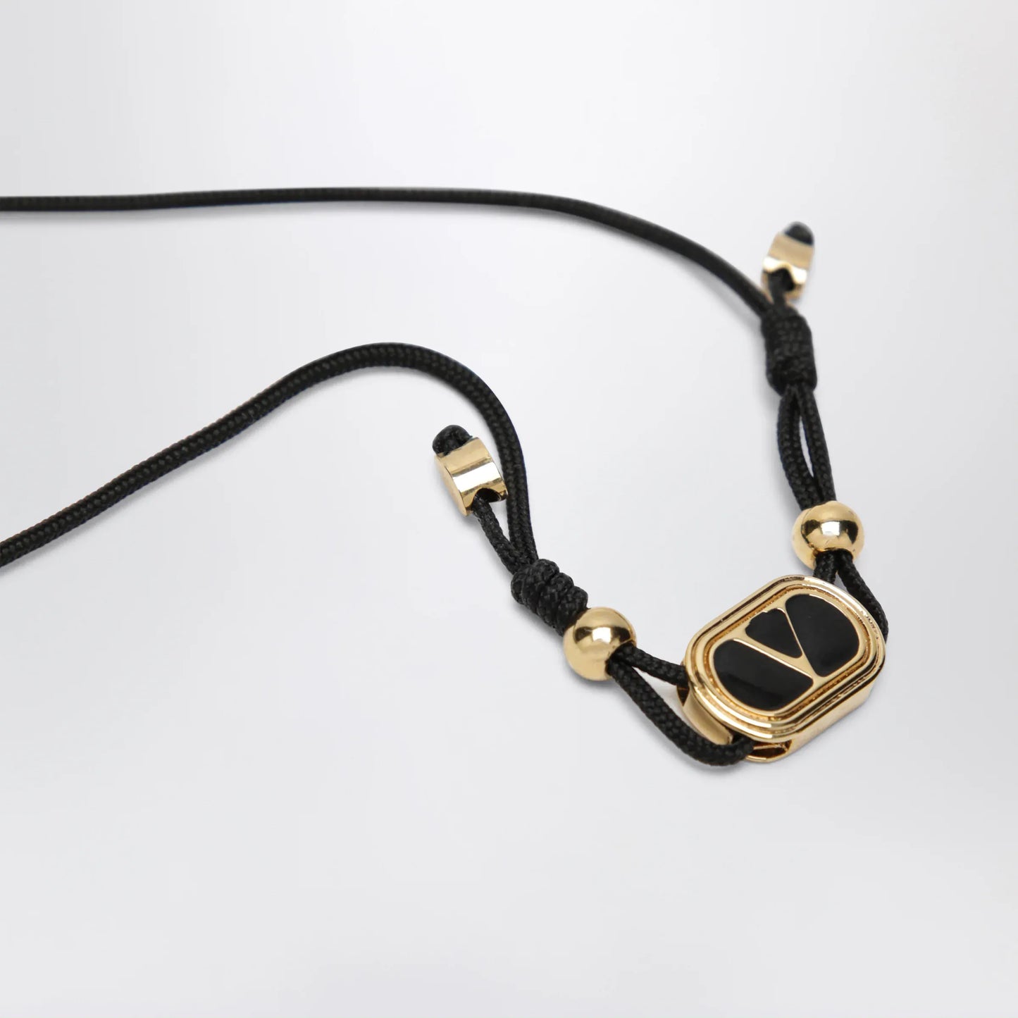 Valentino Garavani - Black cord bracelet with enamelled gold V logo