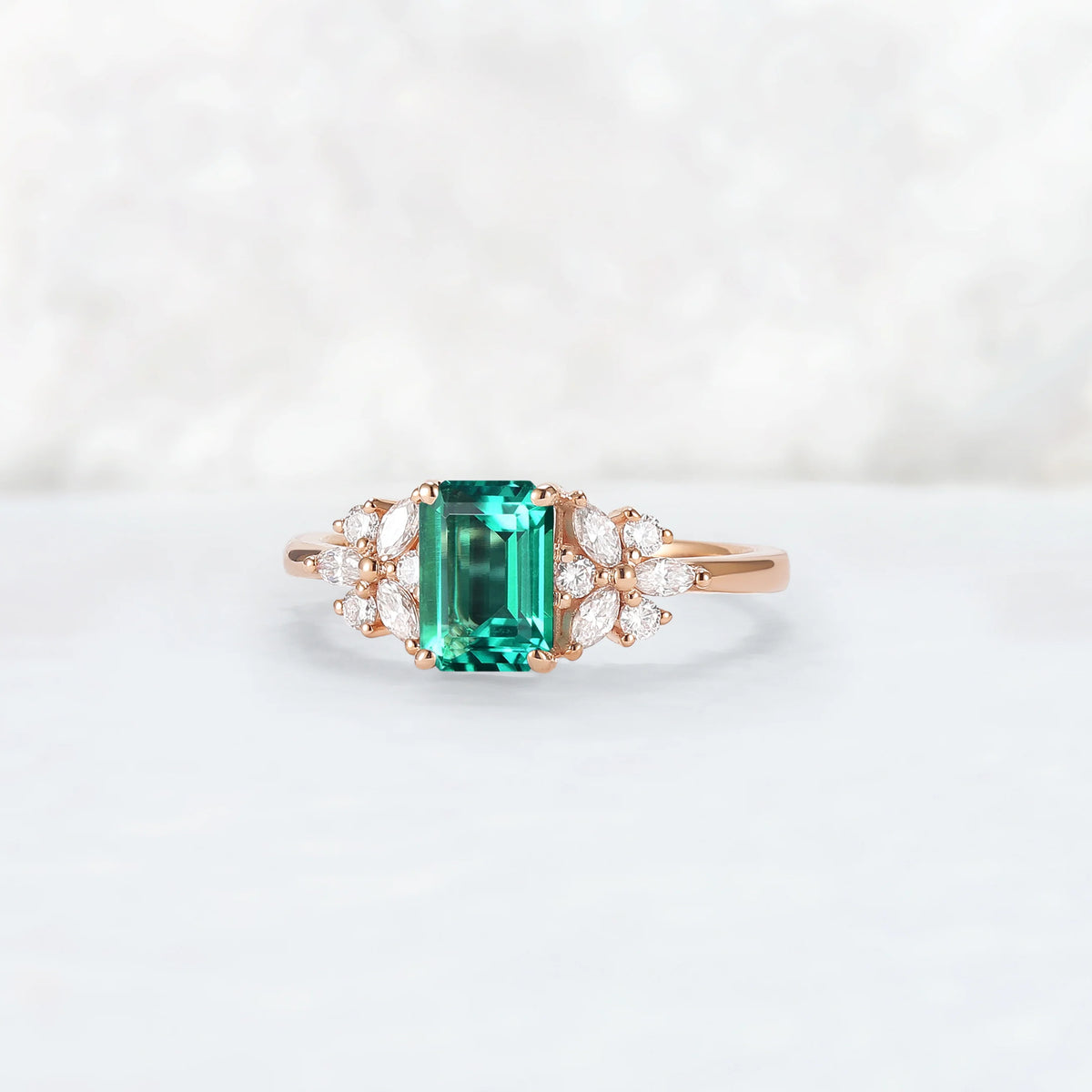 Nature Inspired Emerald Cut Emerald Ring with Petal Moissanite Side Stones