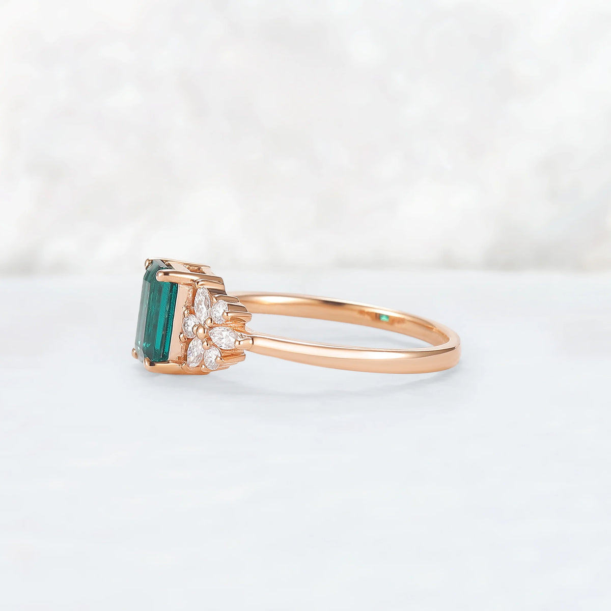 Nature Inspired Emerald Cut Emerald Ring with Petal Moissanite Side Stones