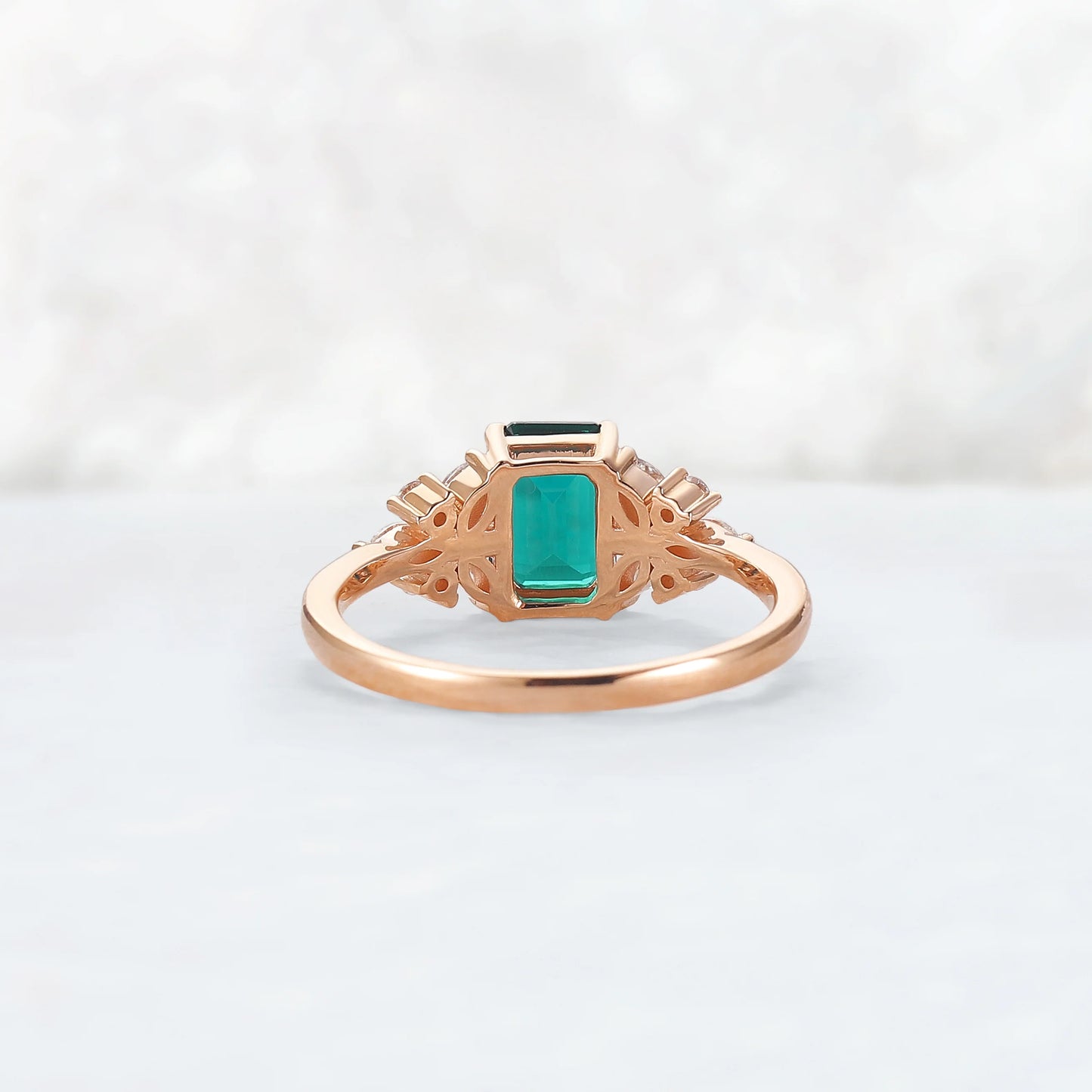 Nature Inspired Emerald Cut Emerald Ring with Petal Moissanite Side Stones