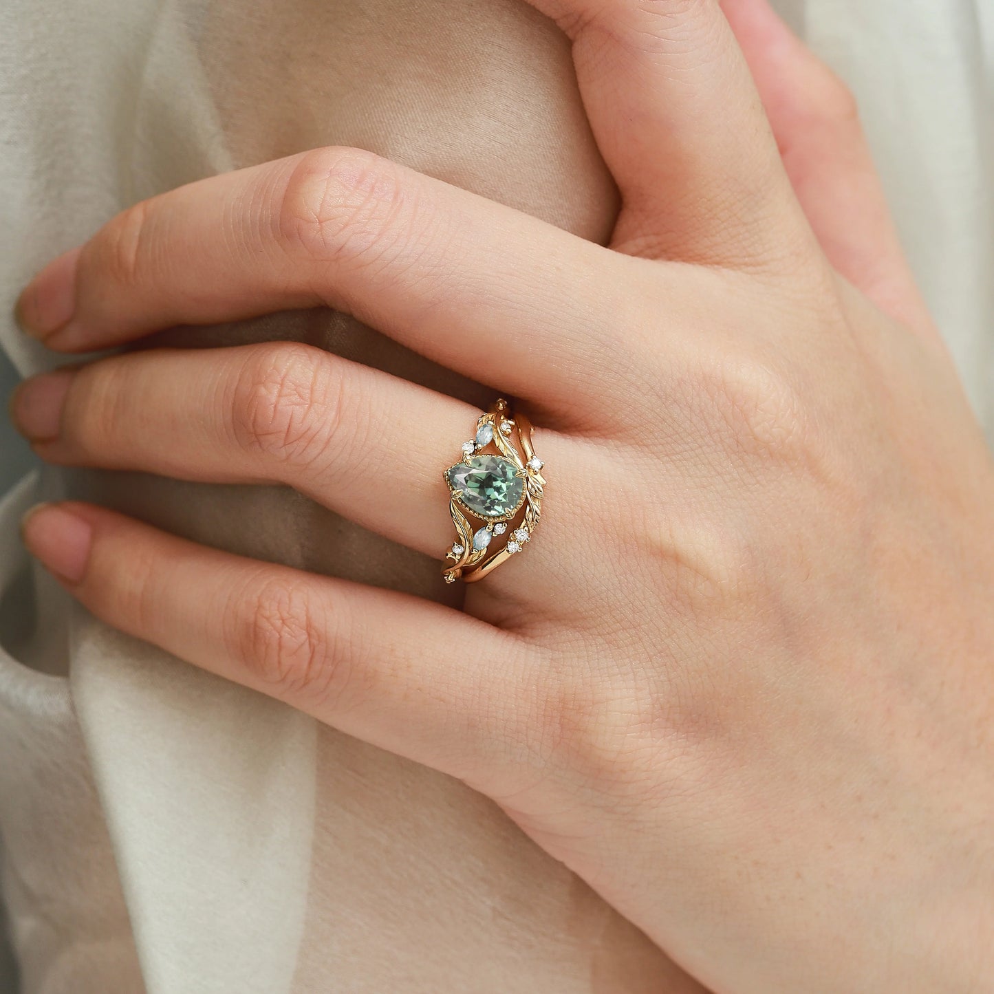 Nature-Inspired Leaf Vintage Bezel Pear Cut Green Sapphire Bridal Set