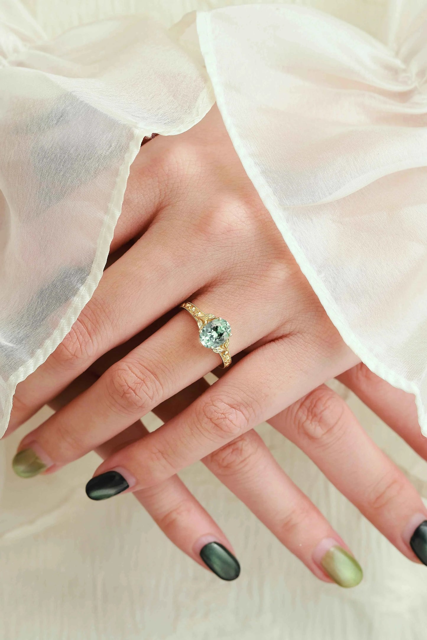 Oval-Cut Green Sapphire Engagement Ring with Leaf-Embraced Band