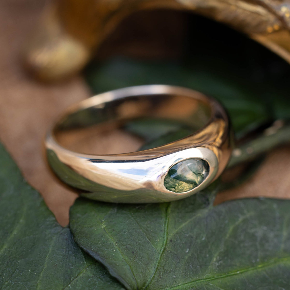 "Luka" - Signet Engagement Ring Featuring Bezel Set Oval Cut Moss Agate & A Hidden Sun Design