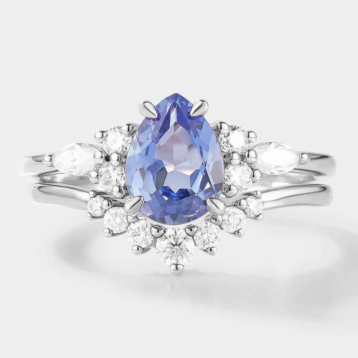 Pear Cut Cornflower Sapphire Engagement Ring With Curved Wedding Band