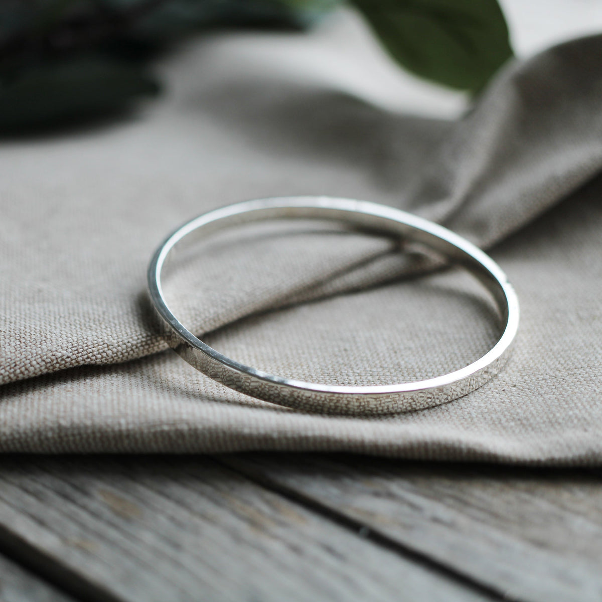 Thick hammered silver bangle