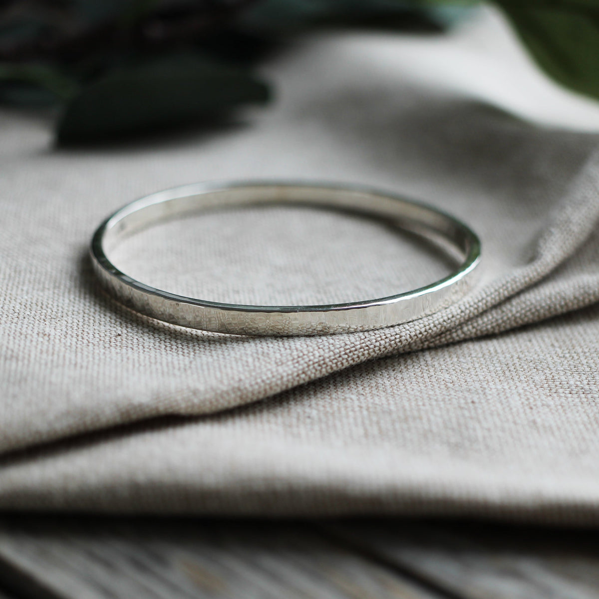 Thick hammered silver bangle