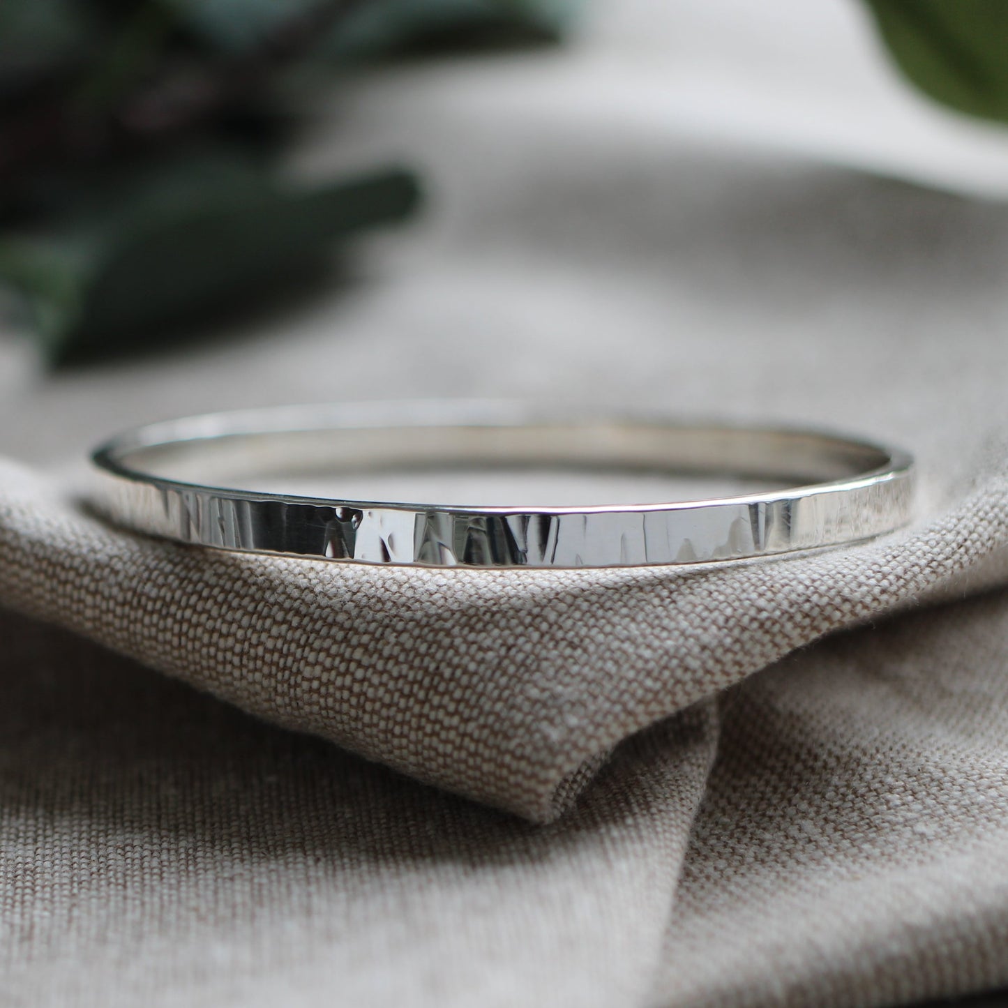 Thick hammered silver bangle