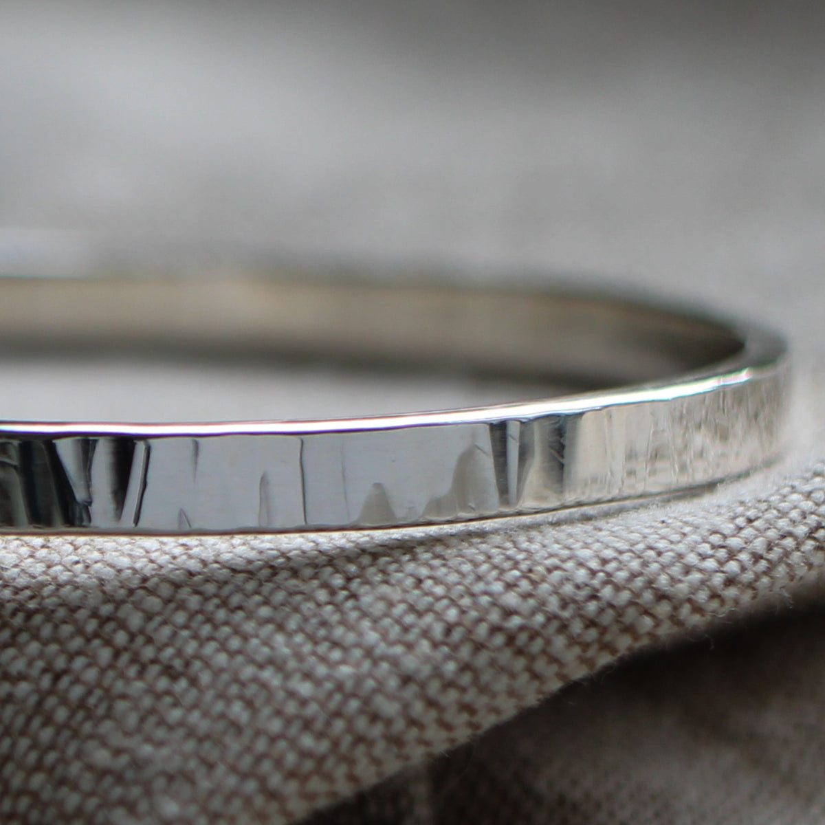 Thick hammered silver bangle