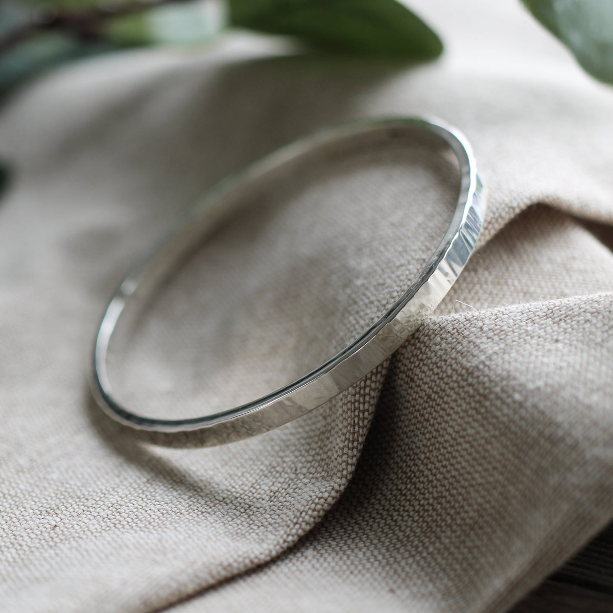 Thick hammered silver bangle
