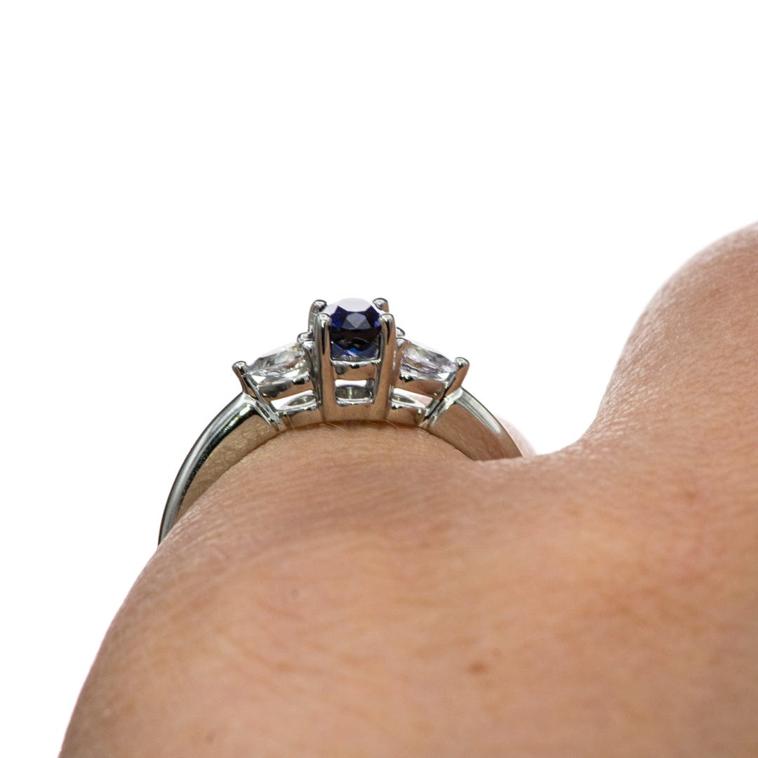 Tressa - Three Stone Prong Set Oval Lab Sapphire Engagement Ring with Pear-shaped White Sapphire Accents