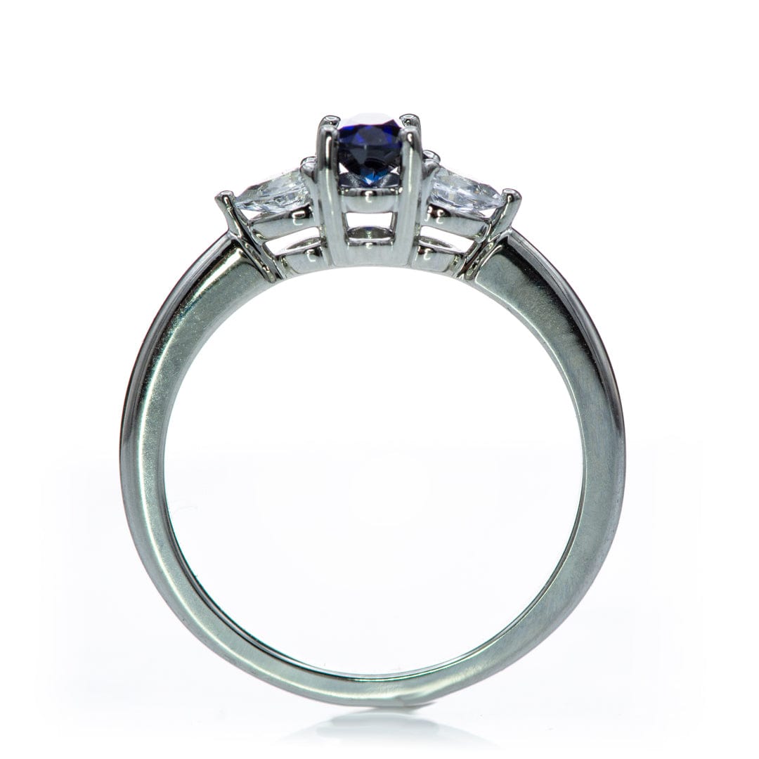 Tressa - Three Stone Prong Set Oval Lab Sapphire Engagement Ring with Pear-shaped White Sapphire Accents