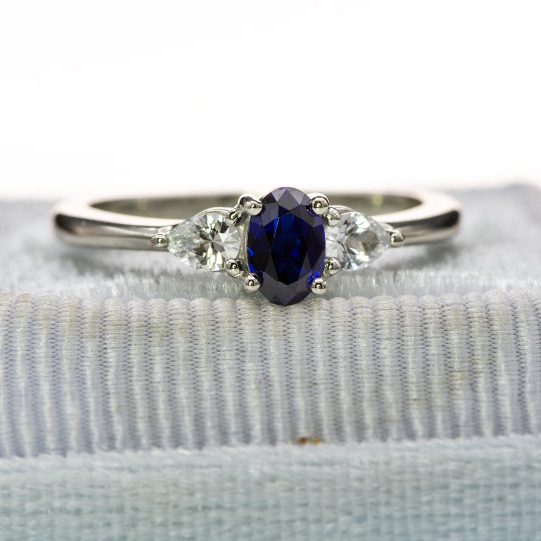 Tressa - Three Stone Prong Set Oval Lab Sapphire Engagement Ring with Pear-shaped White Sapphire Accents