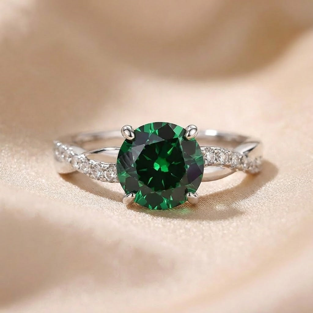 Timeless 1.25ct Twist Round Cut Emerald Green Engagement Ring In Sterling Silver