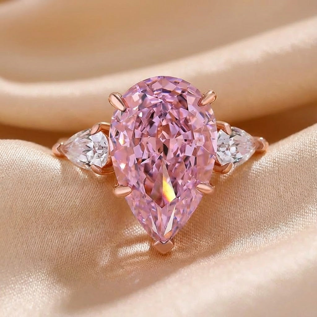 Majestic Pear Cut 4.0ct Pink Stone Three Stone Engagement Ring In Sterling Silver