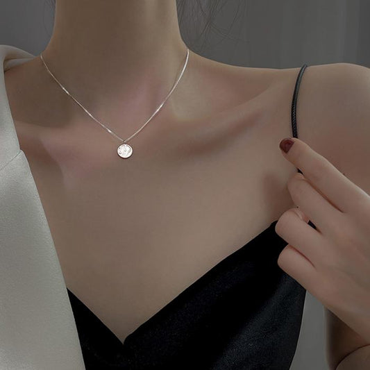 Shell medal necklace